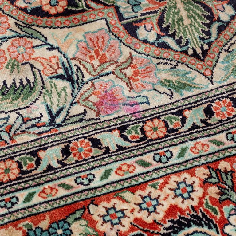 An oriental carpet, mercerized cotton, c. 275 x 182 cm.
