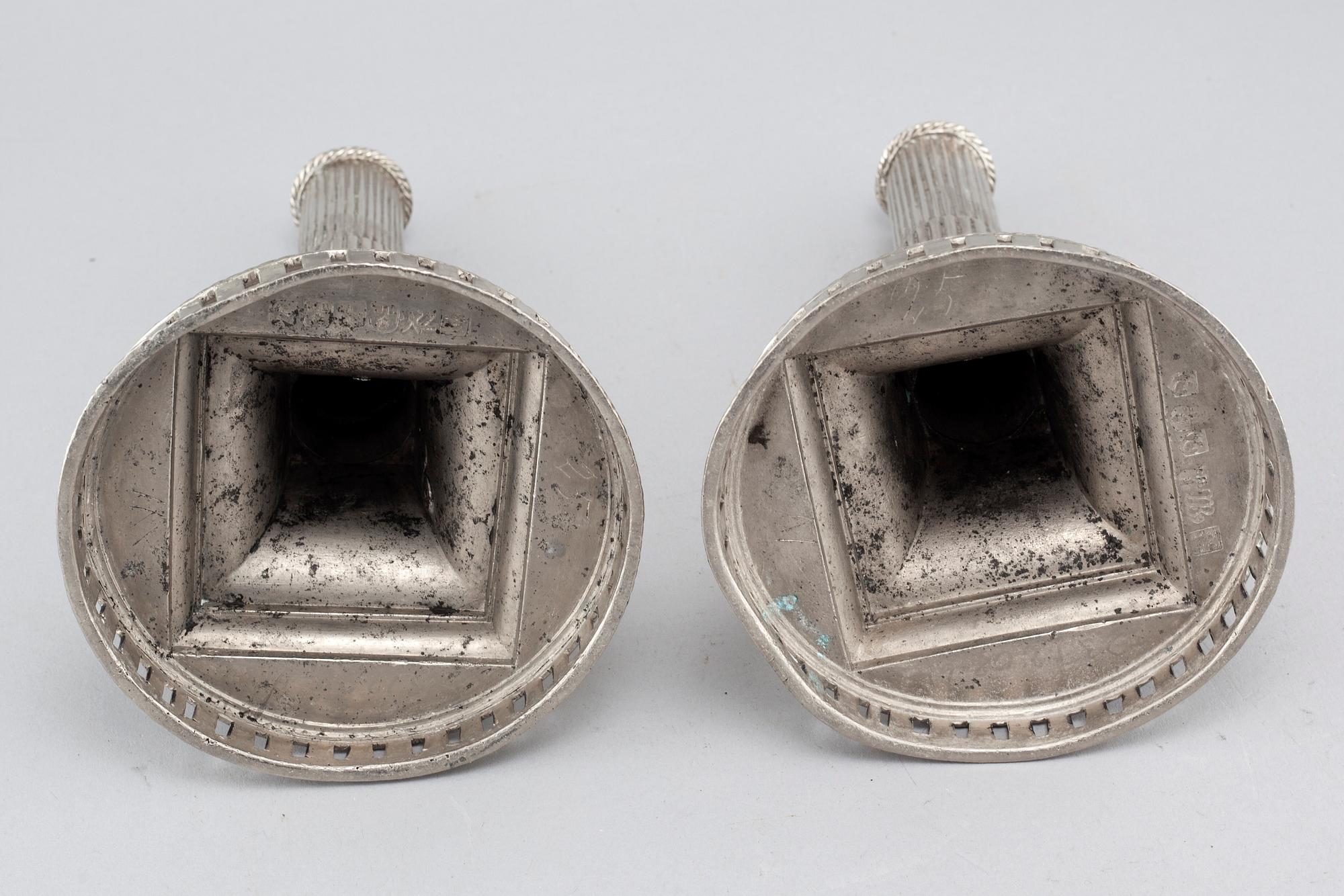 A pair of candlesticks in silver-plated pewter, by Gottlob Friedrich Baumann in Hudiksvall, 1794 and 1799.
