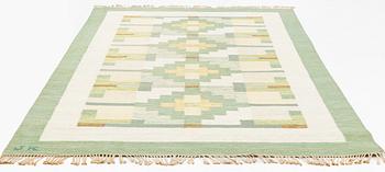 A flat weave carpet, signed JK, ca 310 x 200 cm.