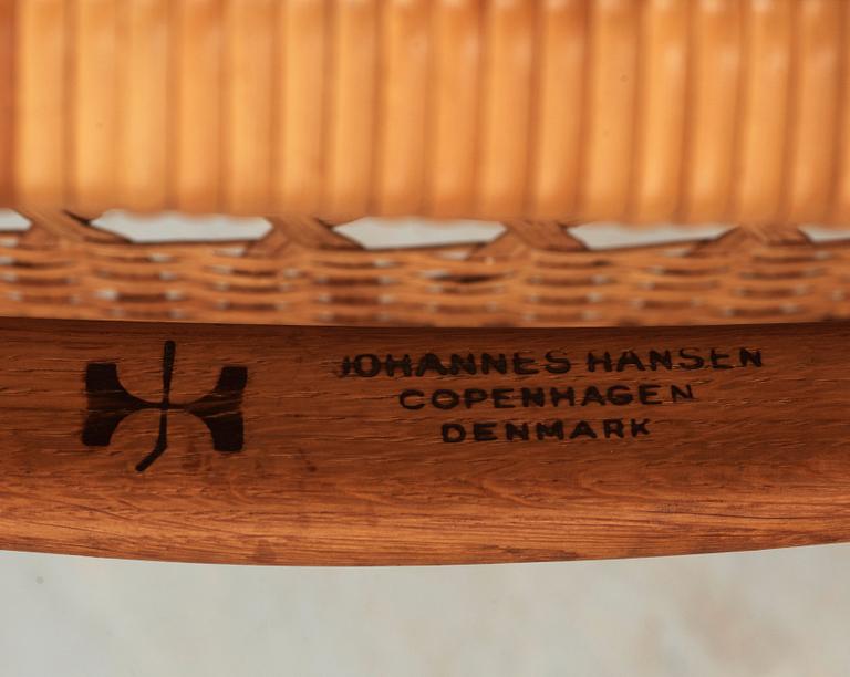 A Hans J Wegner oak and rattan folding chair, by Johannes Hansen, Denmark.