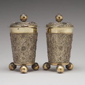 A pair of Swedish 17th century filigree and parcel-gilt silver beakers and covers, mark Rudolf Wittkopf, Stockholm 1698.