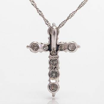 A platinum necklace with a cross pendant set with brilliant-cut diamonds 0.52 ct acording to engraving.