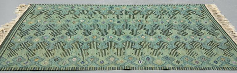 Barbro Nilsson, a carpet, "Kringelikroka, grön" ("Finspong"), flat weave, ca 227,5-231,5 x 174,5-178,5 cm, signed AB MMF BN.