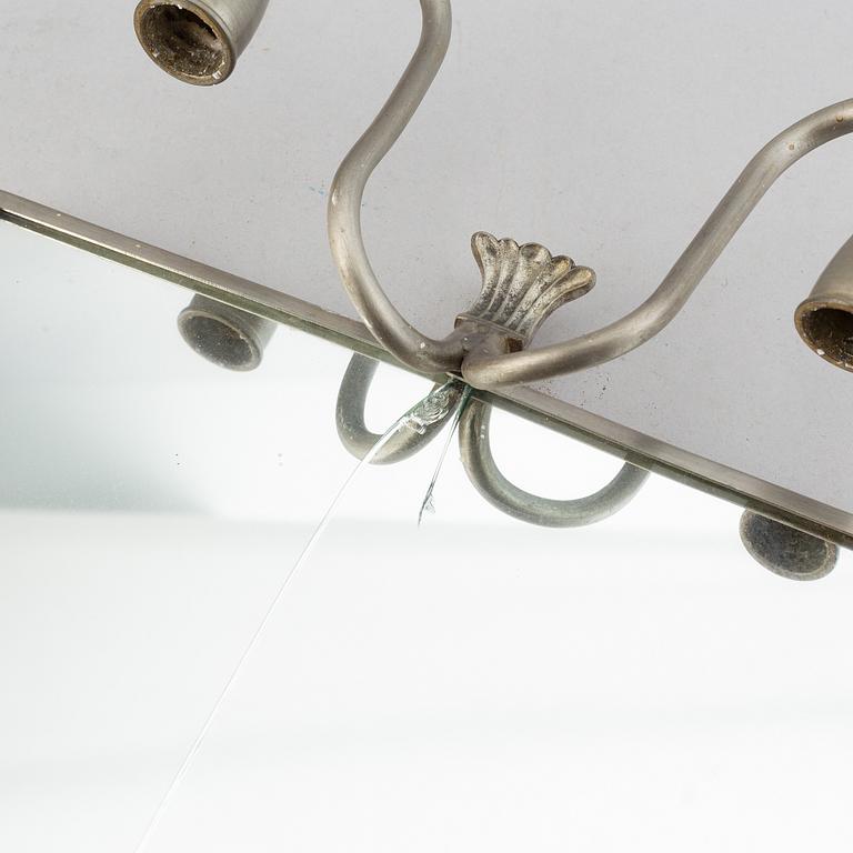 Two pewter wall sconces from Firma Svenskt Tenn, 1925.