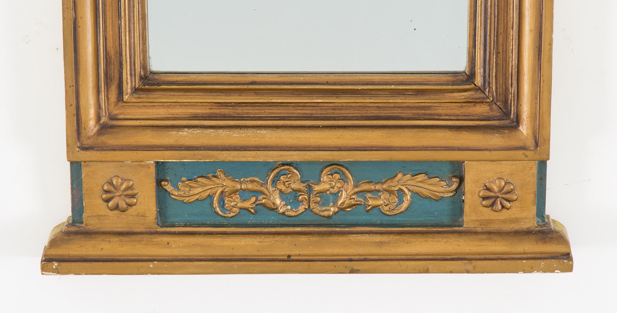 An Empire mirror marked W Lind, first half of the 19th century.