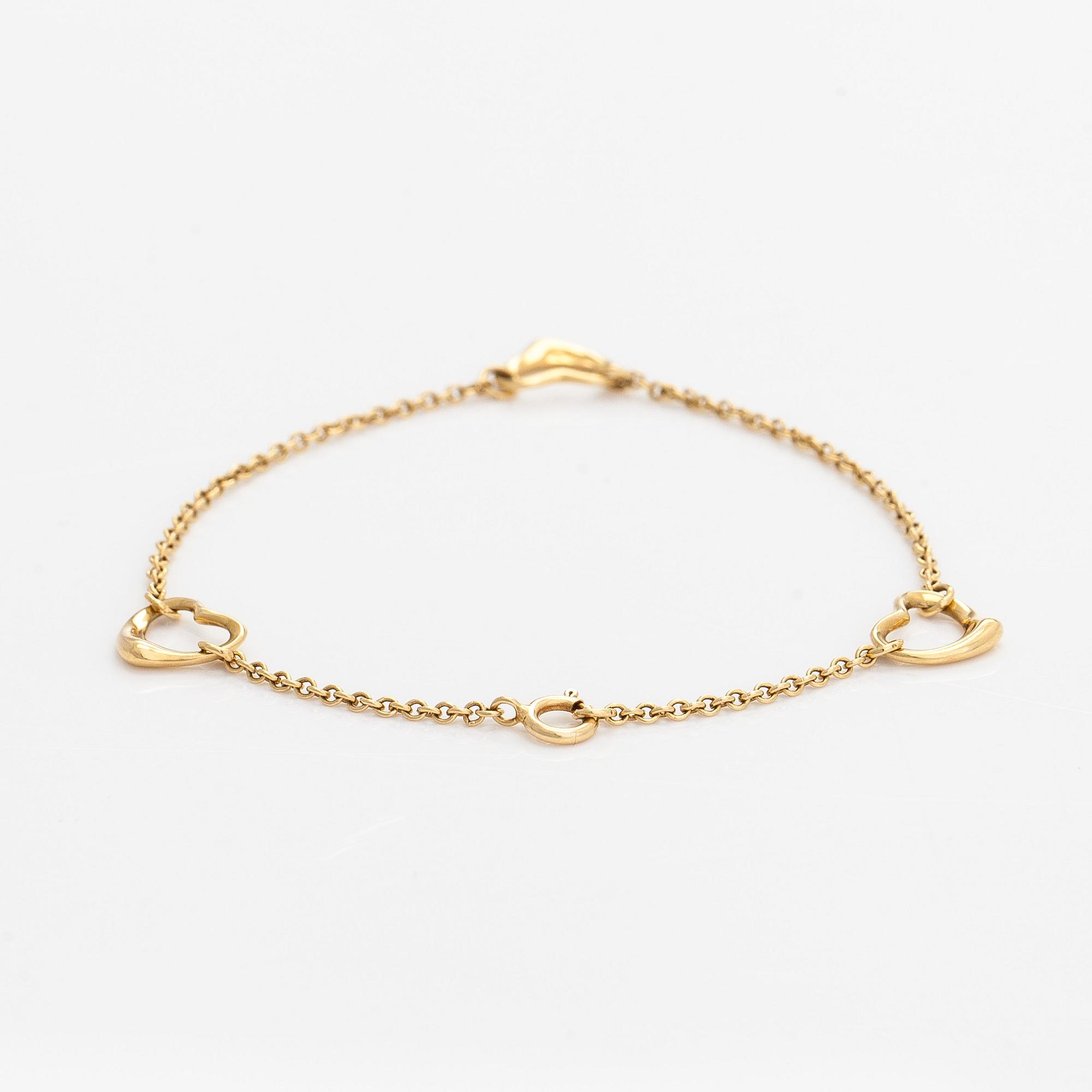 Tiffany & Co, an 18K gold 'Open Heart' bracelet.