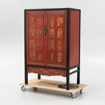 A Chinese lacquered cabinet, 20th century.