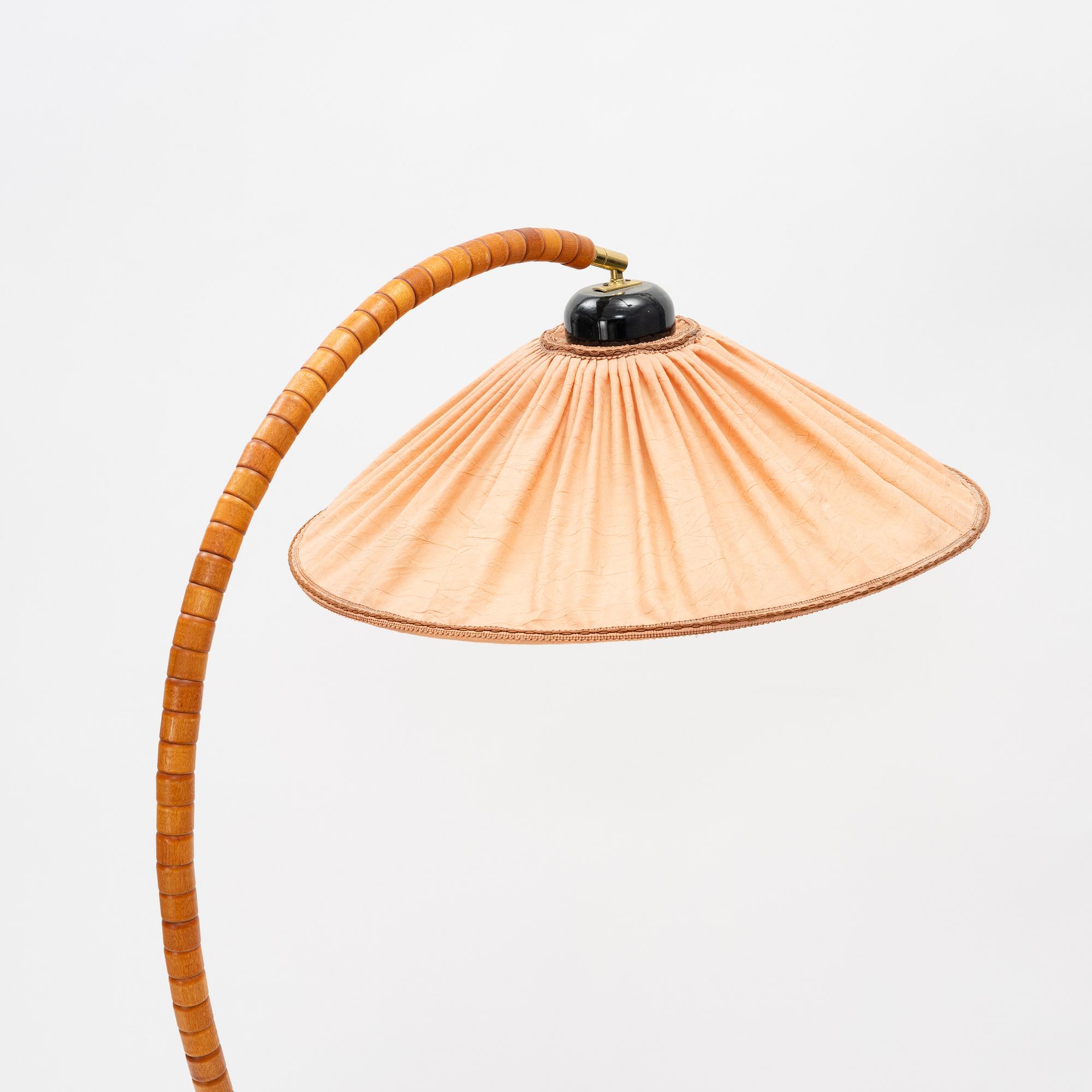 A stained beech floor light, Markslöjd, late 20th Century.