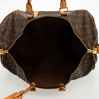Louis Vuitton, a Monogram Canvas 'Keepall 55 Bandoulière' weekend bag.