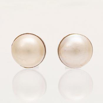 A pair of 18K white gold earrings set with Mabe pearls, Hans Strömdahl Stockholm 1989.