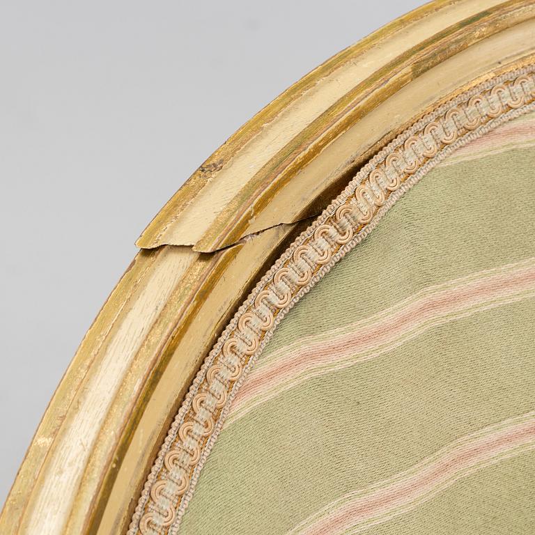 A matched pair of Gustavian style armchairs. One from around the year 1800 and one from around the year 1900.