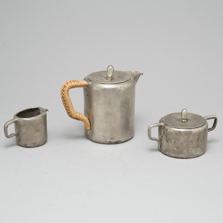 TAGE FOUGSTEDT, a 3 part pewter coffee service, signed and dated 1922.