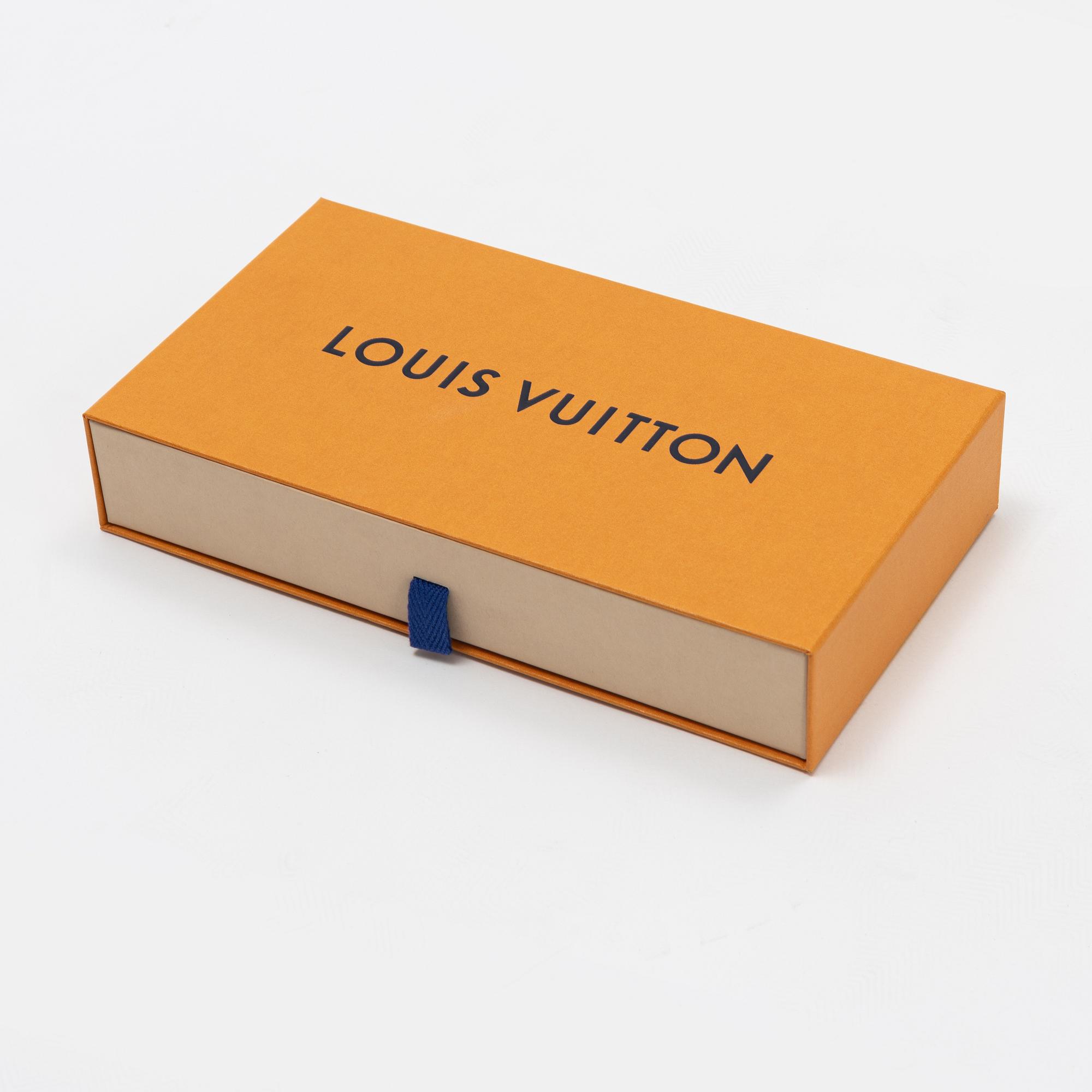 Louis Vuitton, a silk scarf.