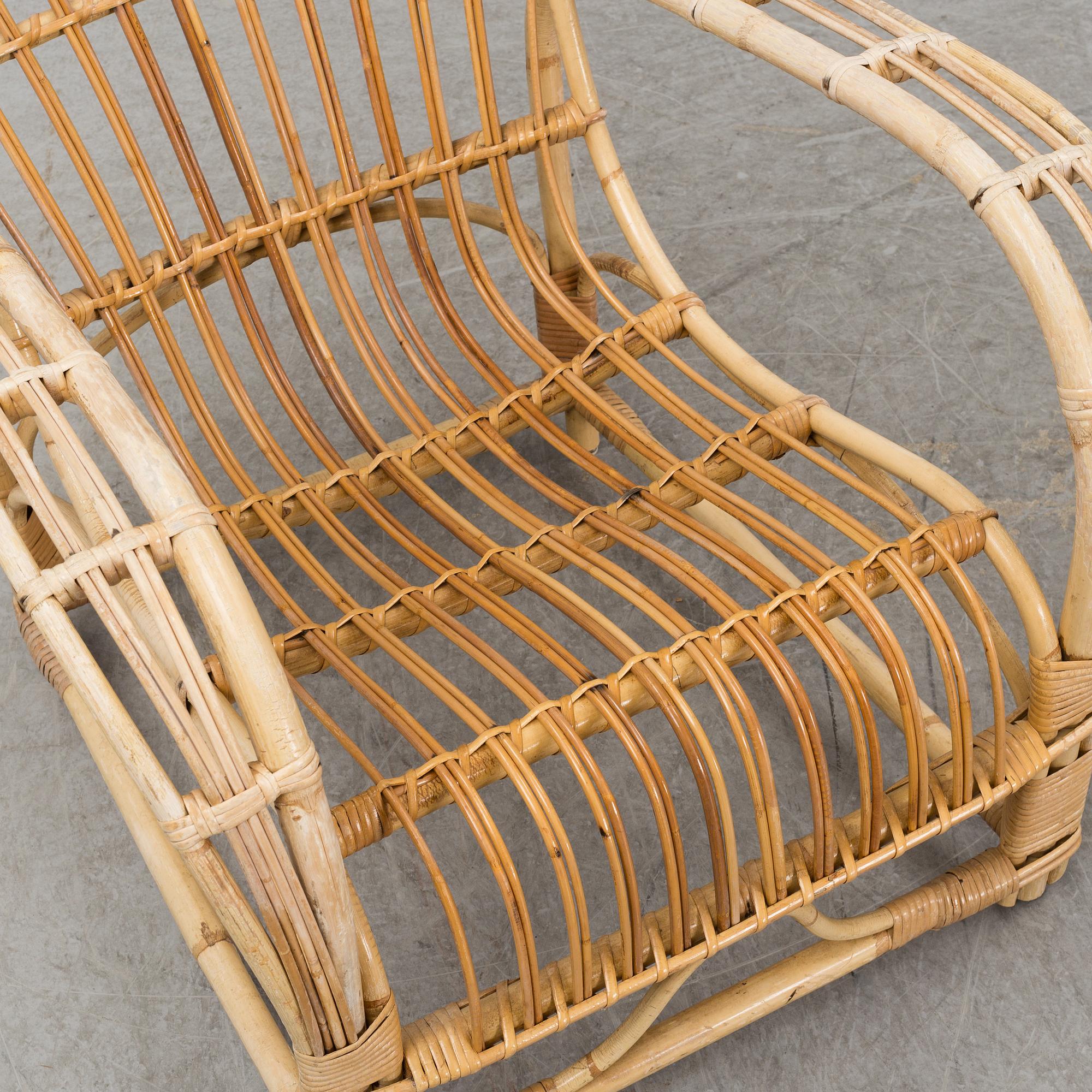 A pair of mid 20th century rattan easy chairs.