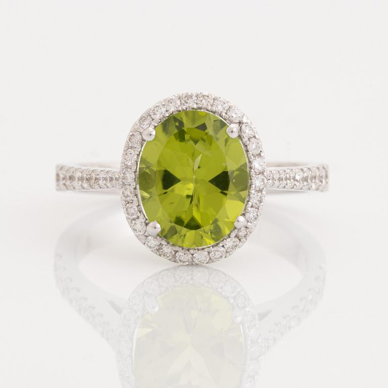 Peridot and brilliant cut diamond ring.