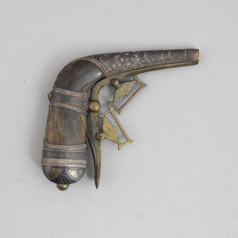 A Caucasian priming flask.