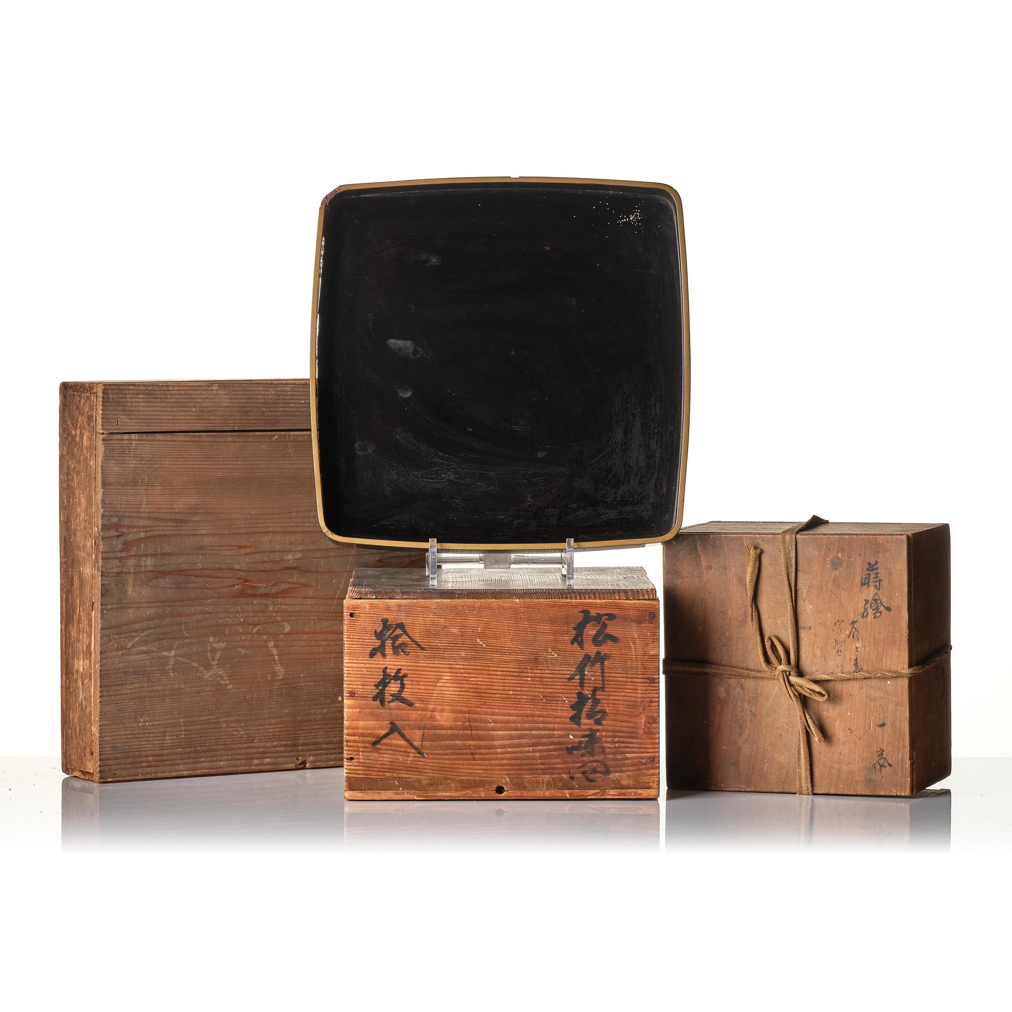 A Japanese lacquer tray and three Japanse wooden boxes.