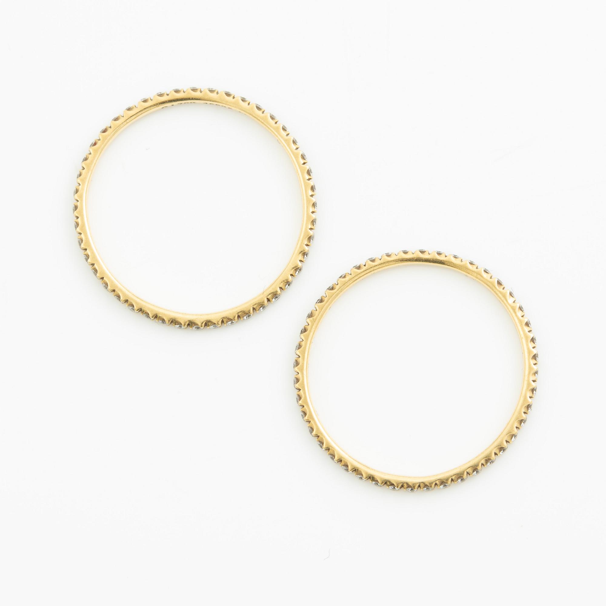 Ringar, Georg Jensen. ett par, "Signature", 18K guld med briljantslipade diamanter.