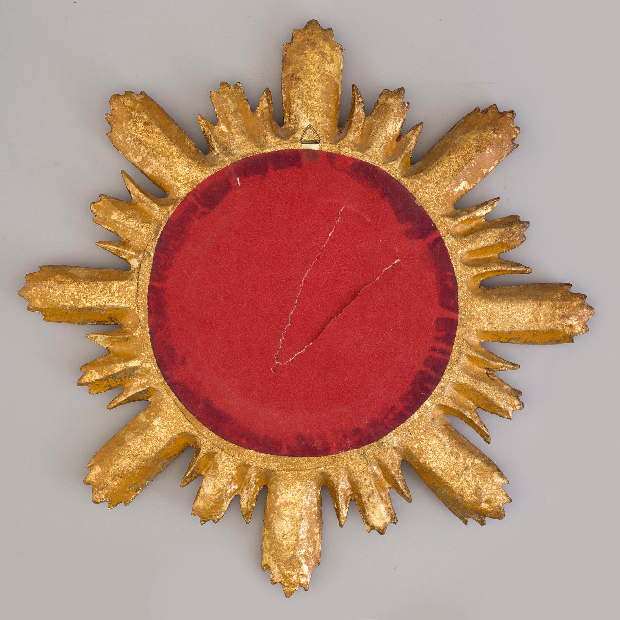 A late 20th Century sun shaped mirror.