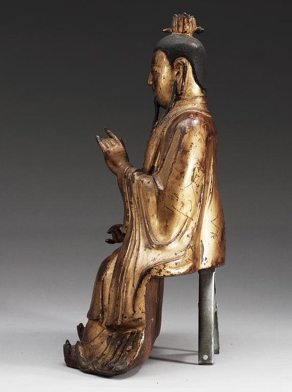 A gilt bronze figure of a High Daoist official, Ming dynasty.