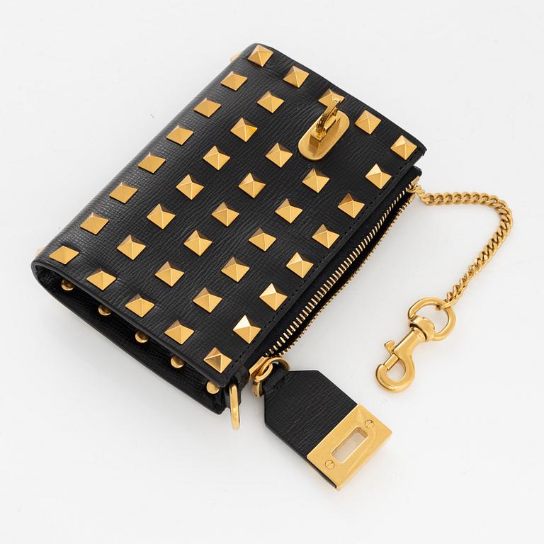 Valentino Garavani, a leather and studs wallet.