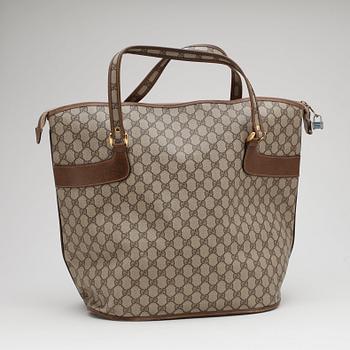 GUCCI, a monogram canvas tote.