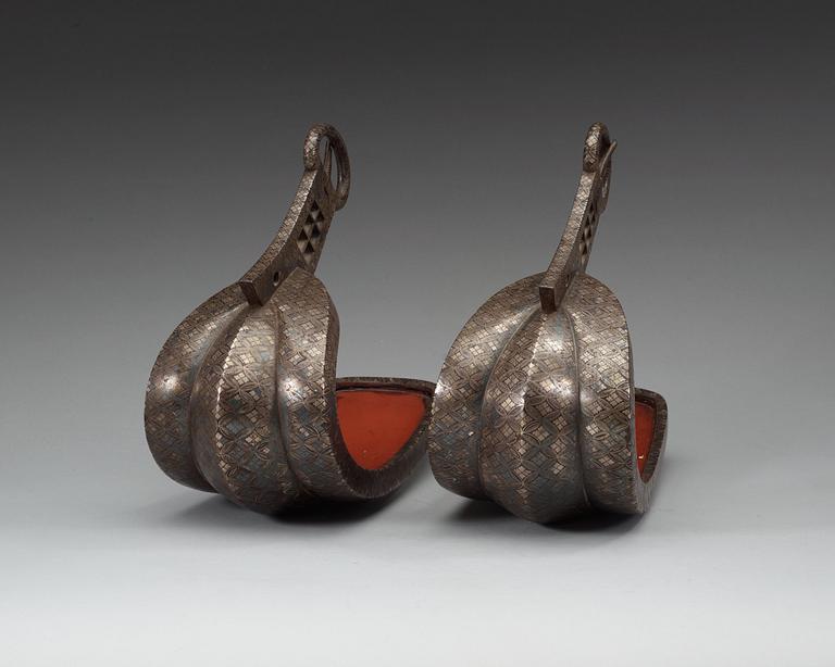 A pair of Japanese silvered bronze stirrups, Meiji (1868-1912).