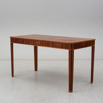 A desk by Carl Malmsten, dated 1979.