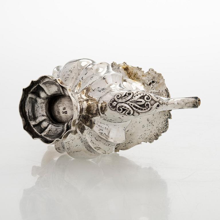 A parcel-gilt silver teapot, Moscow 1845.