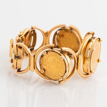 An 18K gold bracelet set with Mexican 22K gold coins.