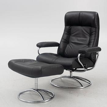 A "Stressless" armchair with ottoman, Ekornes Möbler, Norway, lend of the 20th century.