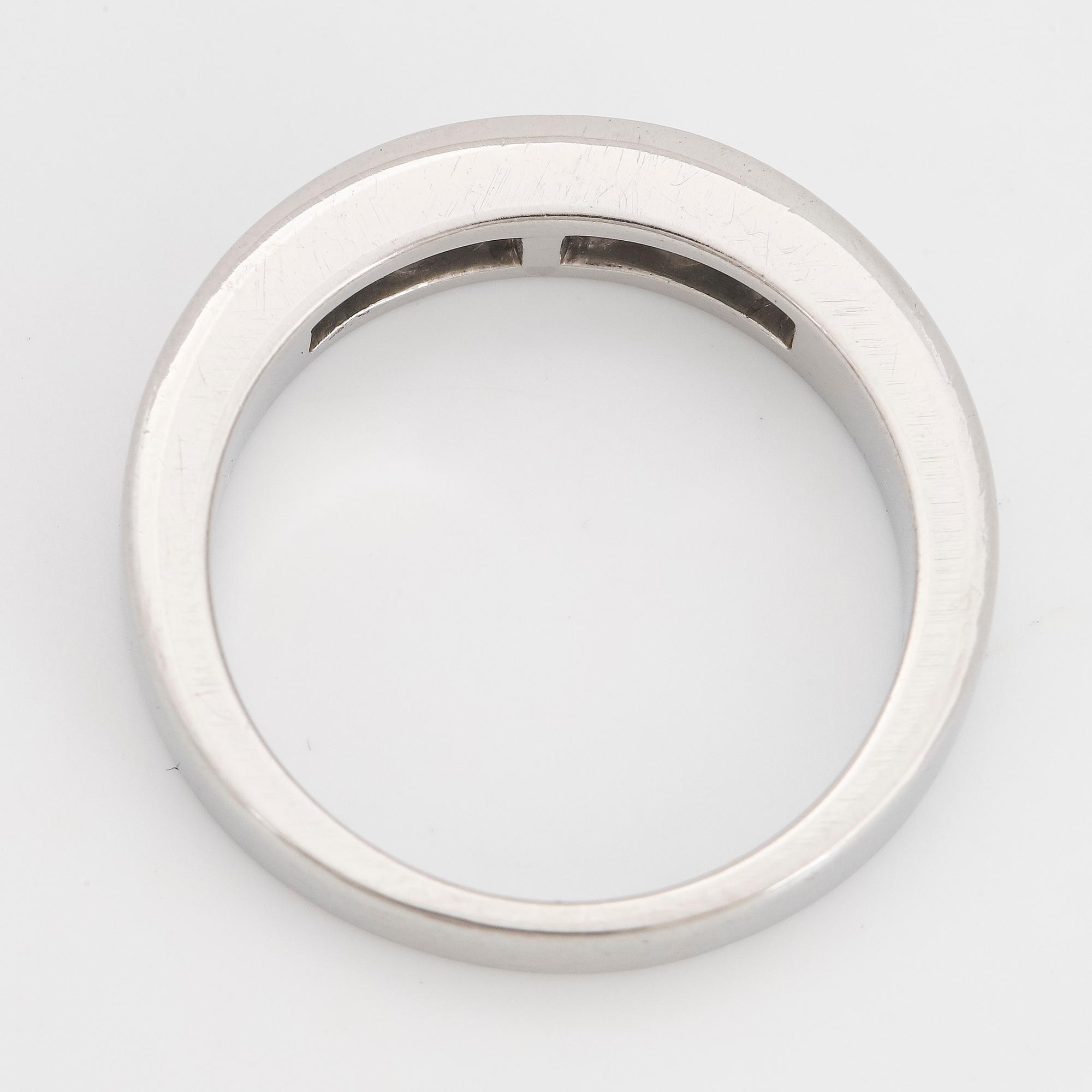 Platinum and six princess-cut diamond ring.