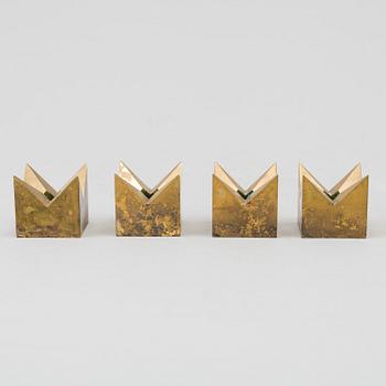 A set of four brass 'Kronan' candlesticks by Pierre Forsell, Skultuna.