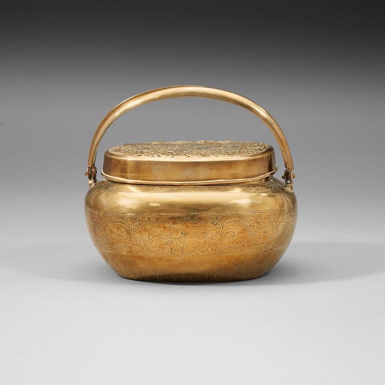 A Chinese engraved paktong hand warmer, Qing dynasty, 19th Century.