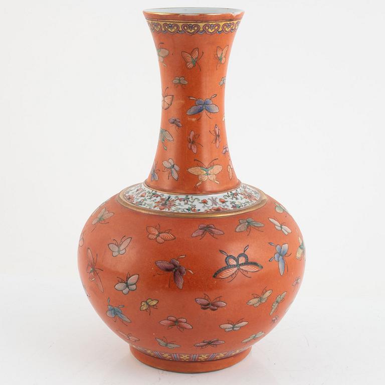 A Chinese coral read ground butterfly vase, 20th century.