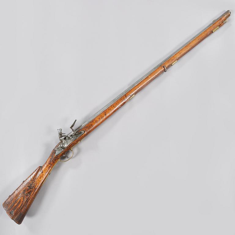 A flintlock rifle, 18th century.