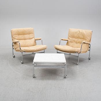 Bruno Mathsson, a pair of easy chairs and a coffee table, 'Karin', Dux, second half of the 20th Century.