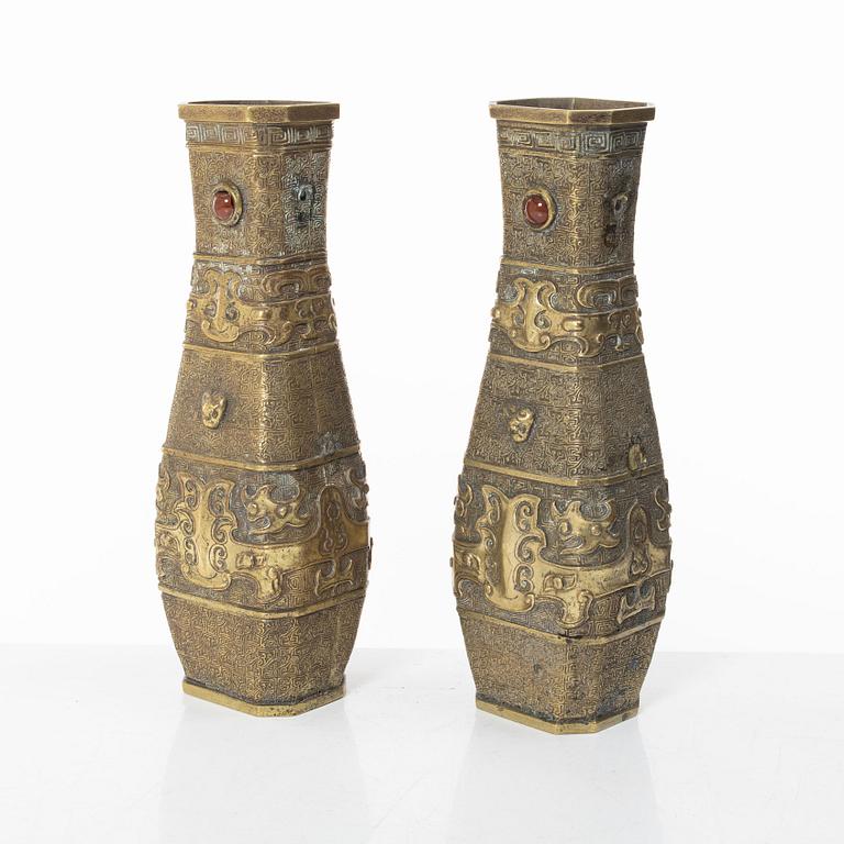 A pair of Chinese gilt bronze vases, Qing dynasty (1644-1912).