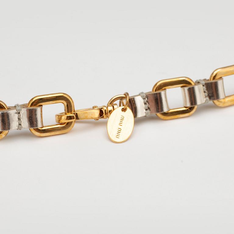 MIU MIU, silver colored patent-leather skinny belt with gold colored chaines.