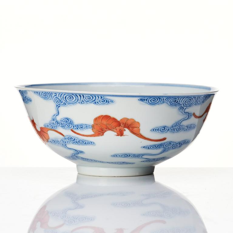 A Chinese iron-red-decorated blue and white Wufu bat bowl, late Qing dynasty, around 1900.