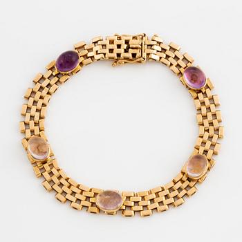 ARMBAND, 18K guld korridorlänk med cabochonslipade ametister.