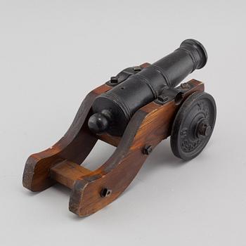 A 20th century salute cannon with wooden gun carriage by Stafsjö Bruk, Sweden.