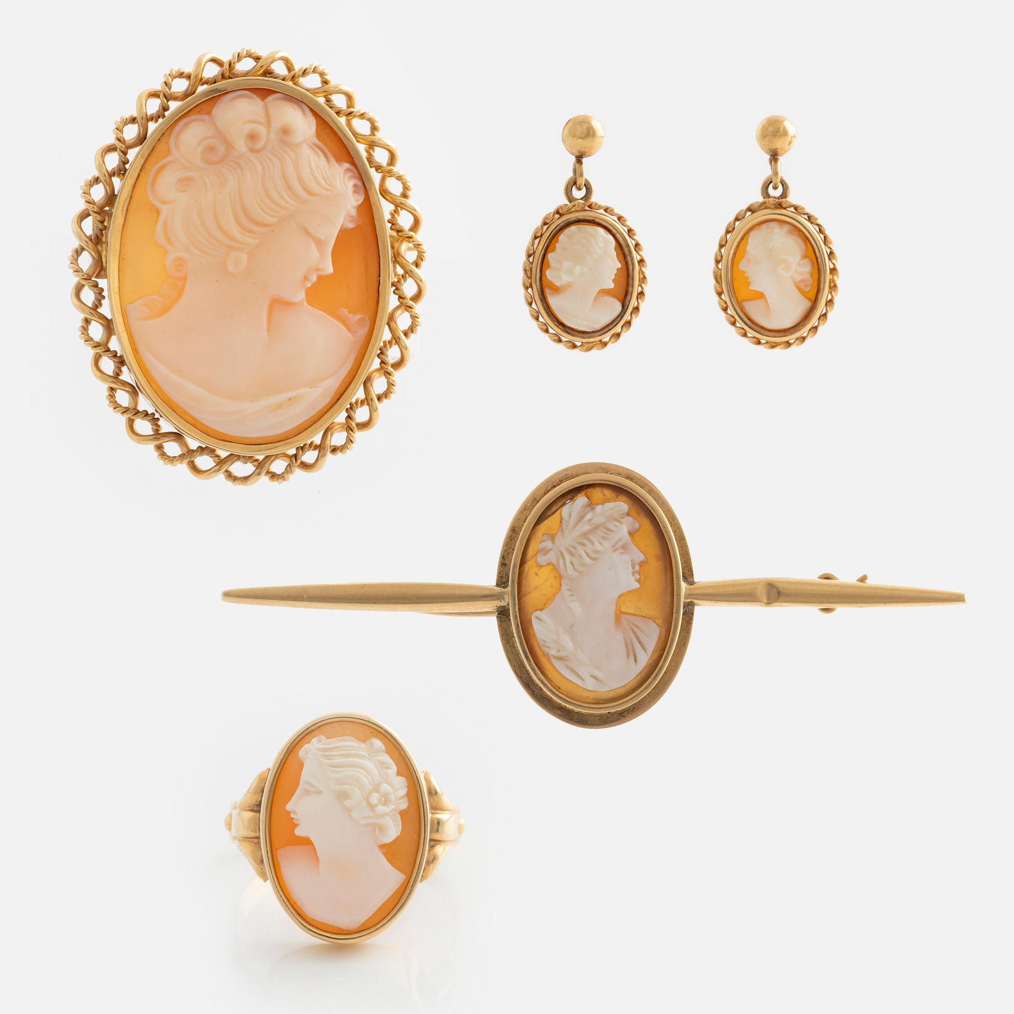 A demi-parure in 18K gold with sea shell cameos.