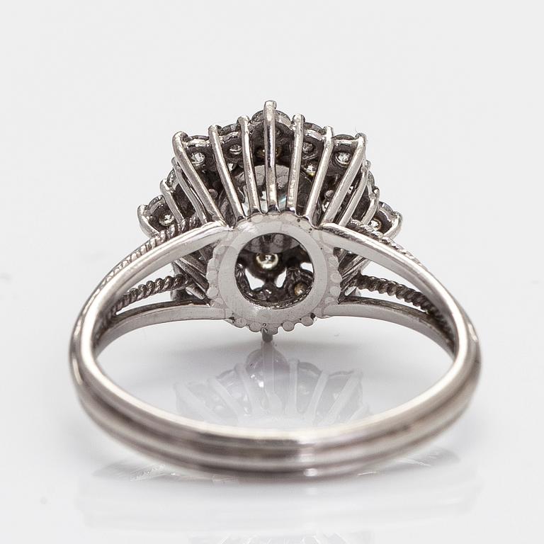 A platinum cluster ring, with diamonds totalling approx. 0.89 ct.