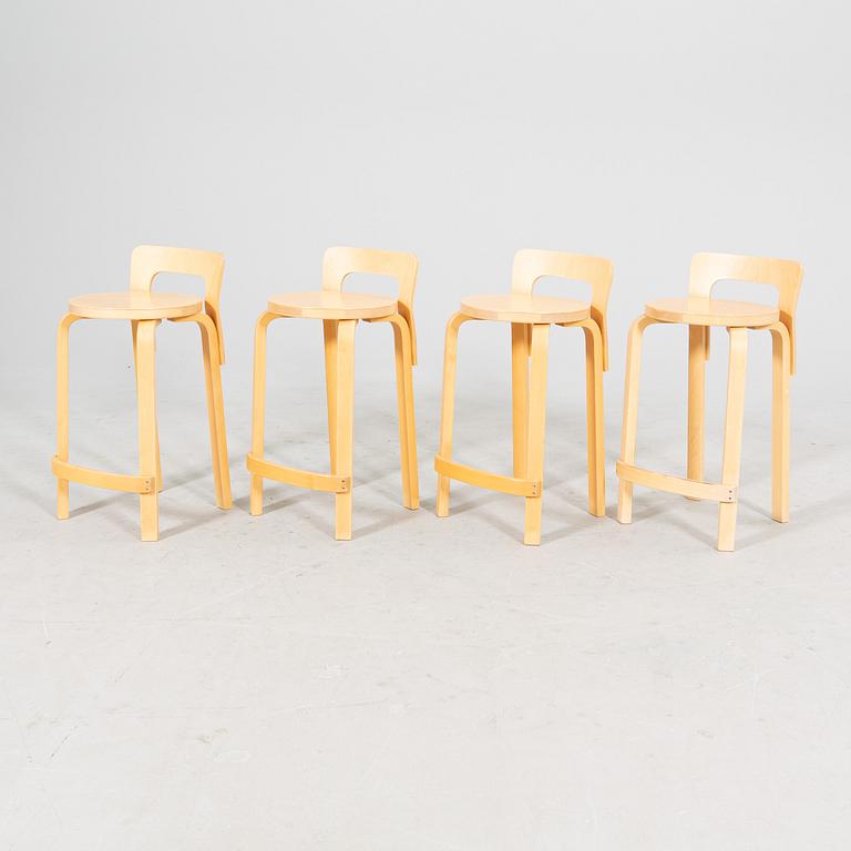 A set of four birch bar stools by Alvar Aalto, modell "K65" Artek, from the second half of 20th century.