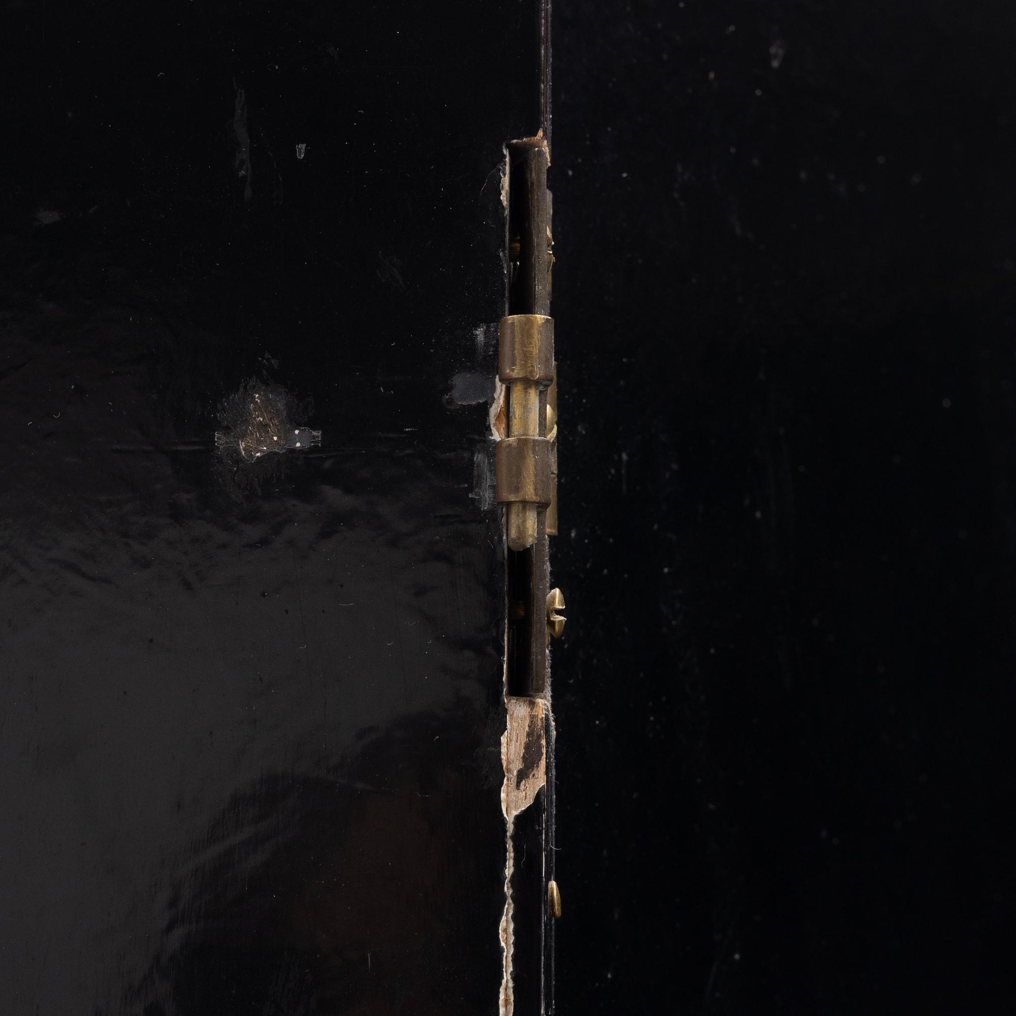 A wooden lacquer screen, 20th century.