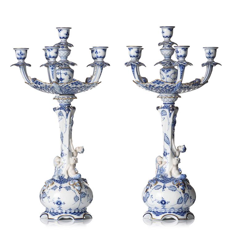 A pair of Royal Copenhagen 'Musselmalet' / 'blue fluted full lace' six-light candelabras, Denmark, 1898-1923.