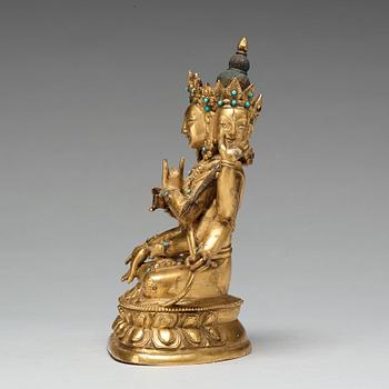 A Sino-Tibetan gilt copper alloy figure of Ushnisha Vinaya, late 18th century/circa 1800.