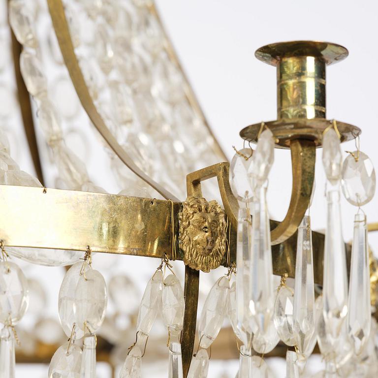 A Swedish gilt brass and cut glass thirteen-light Empire chandelier, early 19th century.