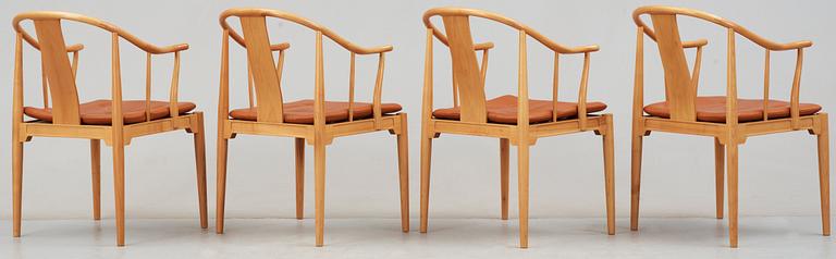 A pair of Hans J Wegner cherry and brown leather 'China chairs', Fritz Hansen, Denmark 1989.